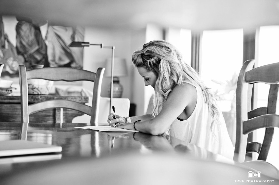 Bride writing her vows in this intimate special candid moment