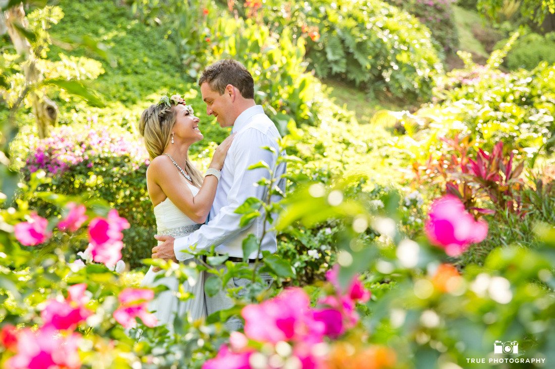 Shooting through flowers to for this romantic destination wedding moment.