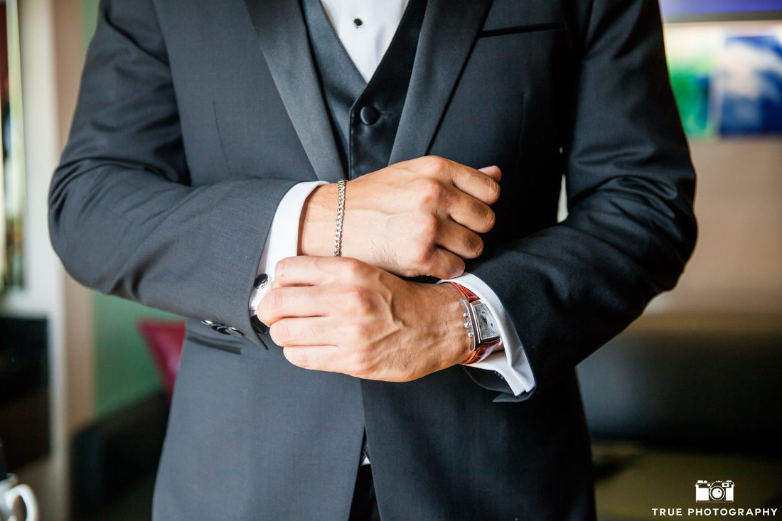 Close-up of groom bracelet cuff links and watch