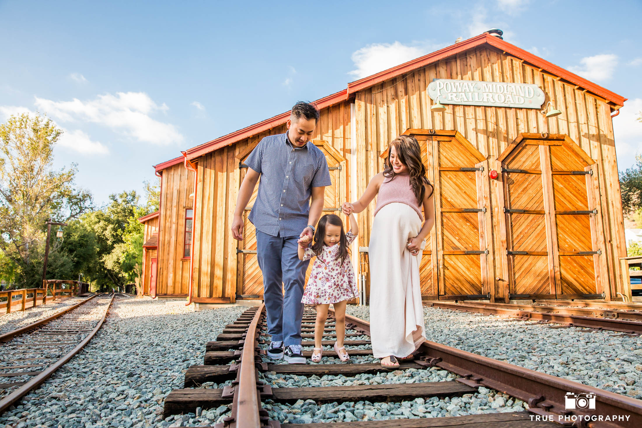 Family session strolling along the train tracks